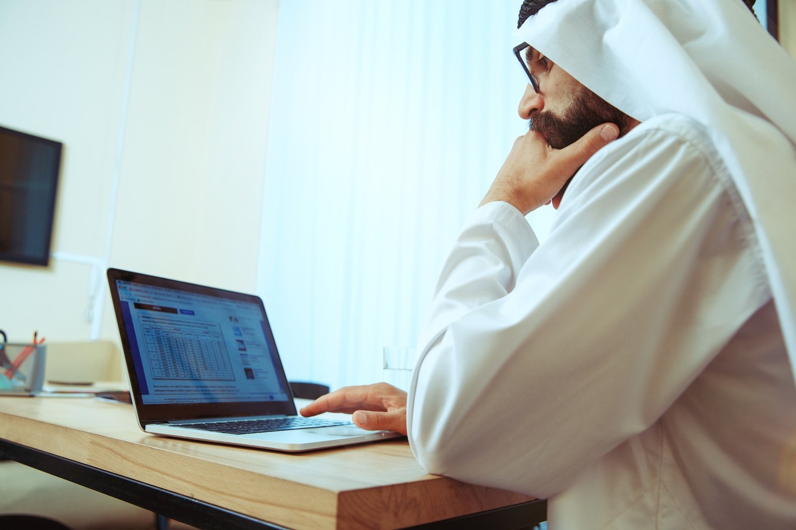 Arabian saudi businessman working in office